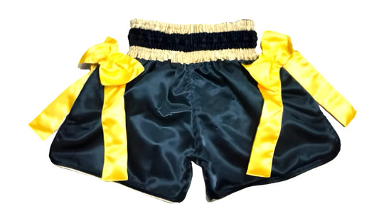 Muay Thai Shorts Black boxing shorts with yellow accents and a skull design on a white background muay thai shorts for men muay thai shorts twins  a product of https://www.shopwarriorstyle.com/
