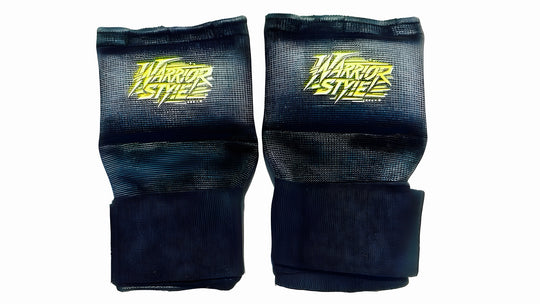 Quick Gel Hand Wraps Black wrist guards with yellow logo on a white background quick hand wrap tutorial Pair of black wrist guards with 'Warrior Style' branding on a white background a product of https://www.shopwarriorstyle.com/
