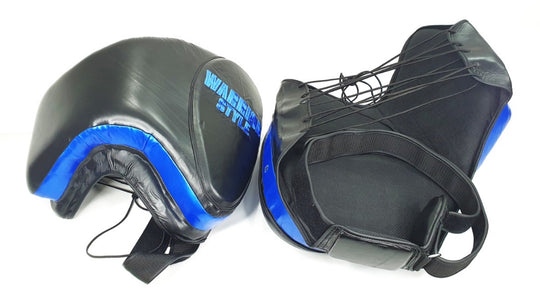 Thigh Pads muay thai elbow pads kick pads karate thai shin pads kick pads wrestling A pair of black leather thigh pads with blue accents, featuring foam padding and a locking nylon waist strap a product of https://www.shopwarriorstyle.com/