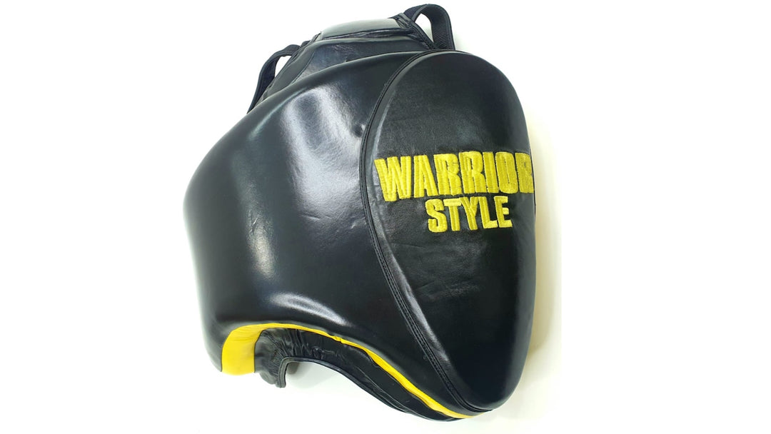 Thigh Pads muay thai elbow pads kick pads karate thai shin pads kick pads wrestling A pair of black leather thigh pads with yellow accents, featuring foam padding and a locking nylon waist strap a product of https://www.shopwarriorstyle.com/