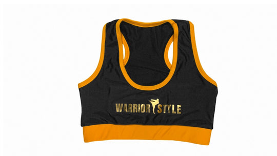 A black and yellow sports bra with a racerback design and the logo 'WARRIOR STYLE' on the front  a product of https://www.shopwarriorstyle.com/