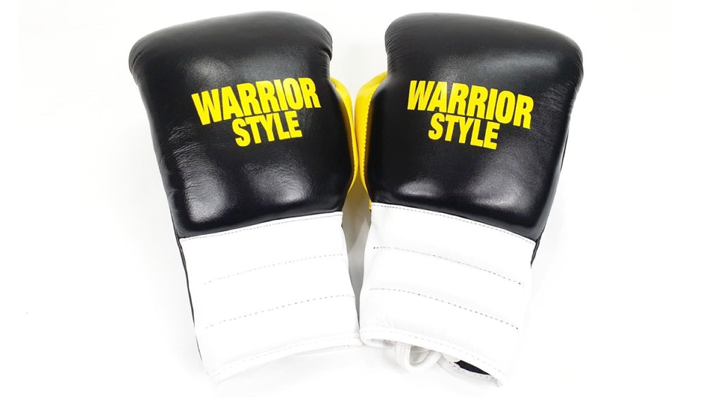 A pair of black and red boxing pro fight gloves with 'WARRIOR STYLE' written on them a product of https://www.shopwarriorstyle.com/
