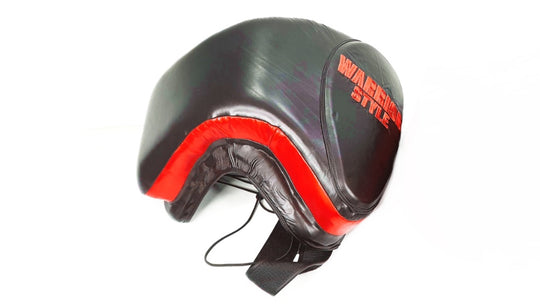 Thigh Pads muay thai elbow pads kick pads karate thai shin pads kick pads wrestling A pair of black leather thigh pads with red accents, featuring foam padding and a locking nylon waist strap a product of https://www.shopwarriorstyle.com/